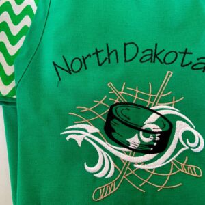 Shop North Dakota North Dakota Hockey Puck Apron