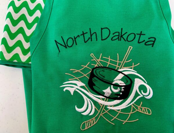 Product image of North Dakota Hockey Puck Apron