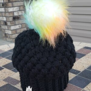 Product image of Black baby hat with colored poof ball 6-12 month size