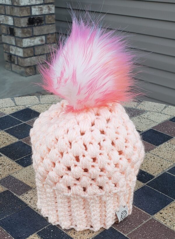 Product image of Light coral sparkly baby hat with colored poof ball 6-12 month size