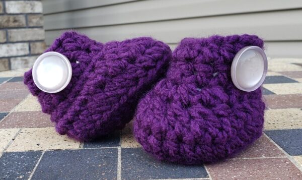 Product image of Purple baby booties with shiny pearl buttons 3-6 months