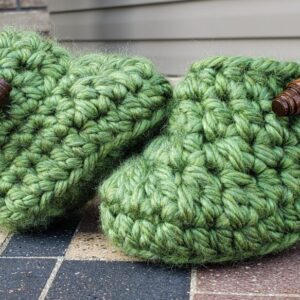 Product image of Green baby booties with brown wooden buttons 3-6 months old