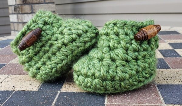 Product image of Green baby booties with brown wooden buttons 3-6 months old