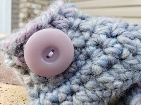 Product image of Grey baby booties with flecks of pink, purple, and blue and light lilac buttons 6-12 months old