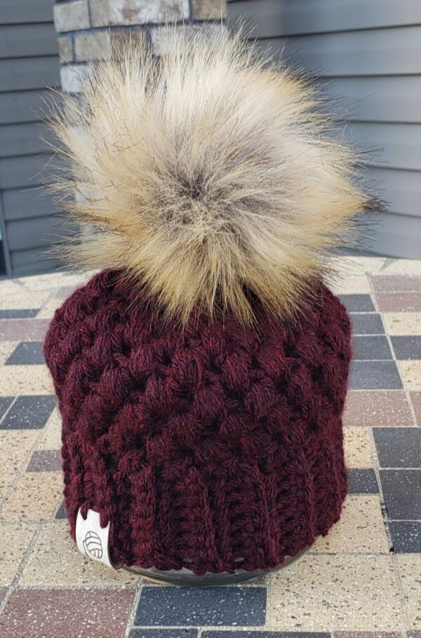 Shop North Dakota Burgundy hat with brown poof ball 0-3 months size
