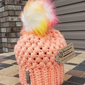 Shop North Dakota Apricot baby hat with multi-colored poof ball 6-12 month size