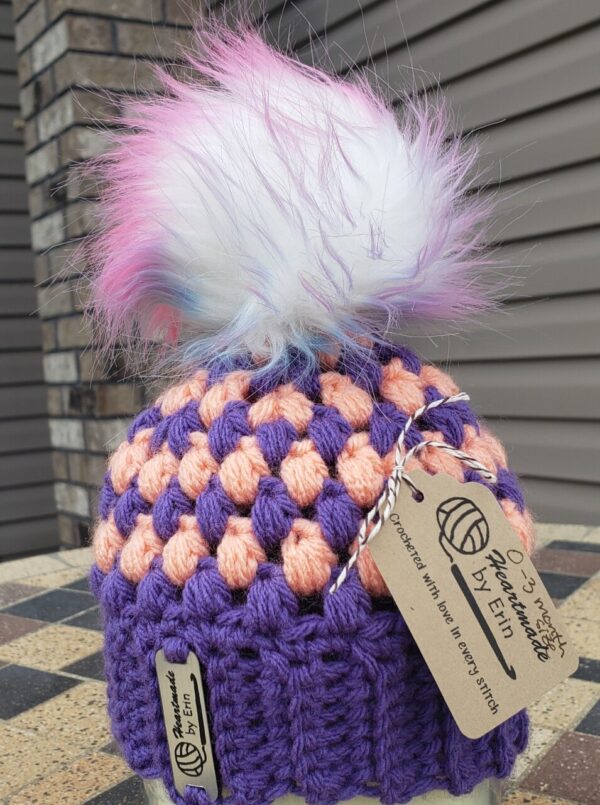 Shop North Dakota Purple and apricot baby hat with poof ball; 0-3 month size