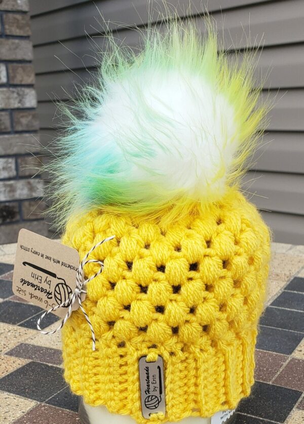 Shop North Dakota Sunny yellow hat with multi colored poof ball; 3-6 month size