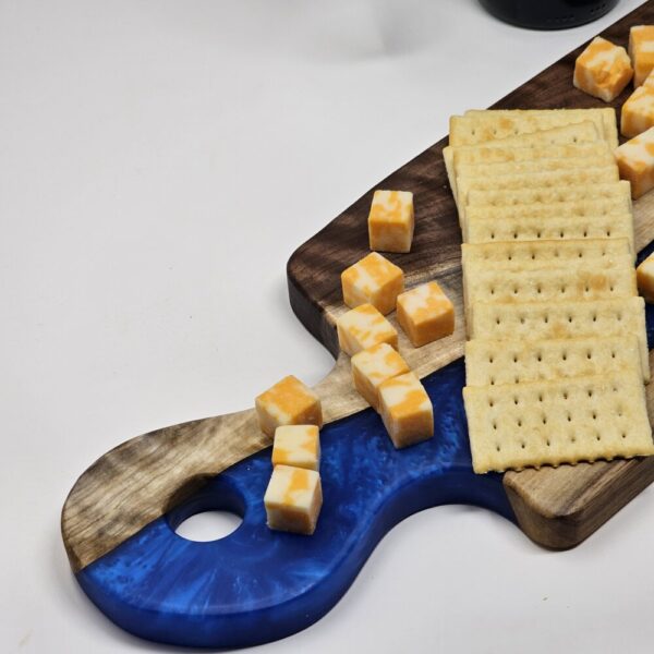 Product image of Long Narrow Walnut and Blue Resin Charcuterie Board with handle