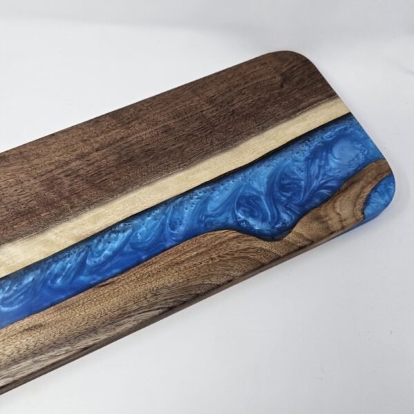 Product image of Long Narrow Walnut and Blue Resin Charcuterie Board with handle